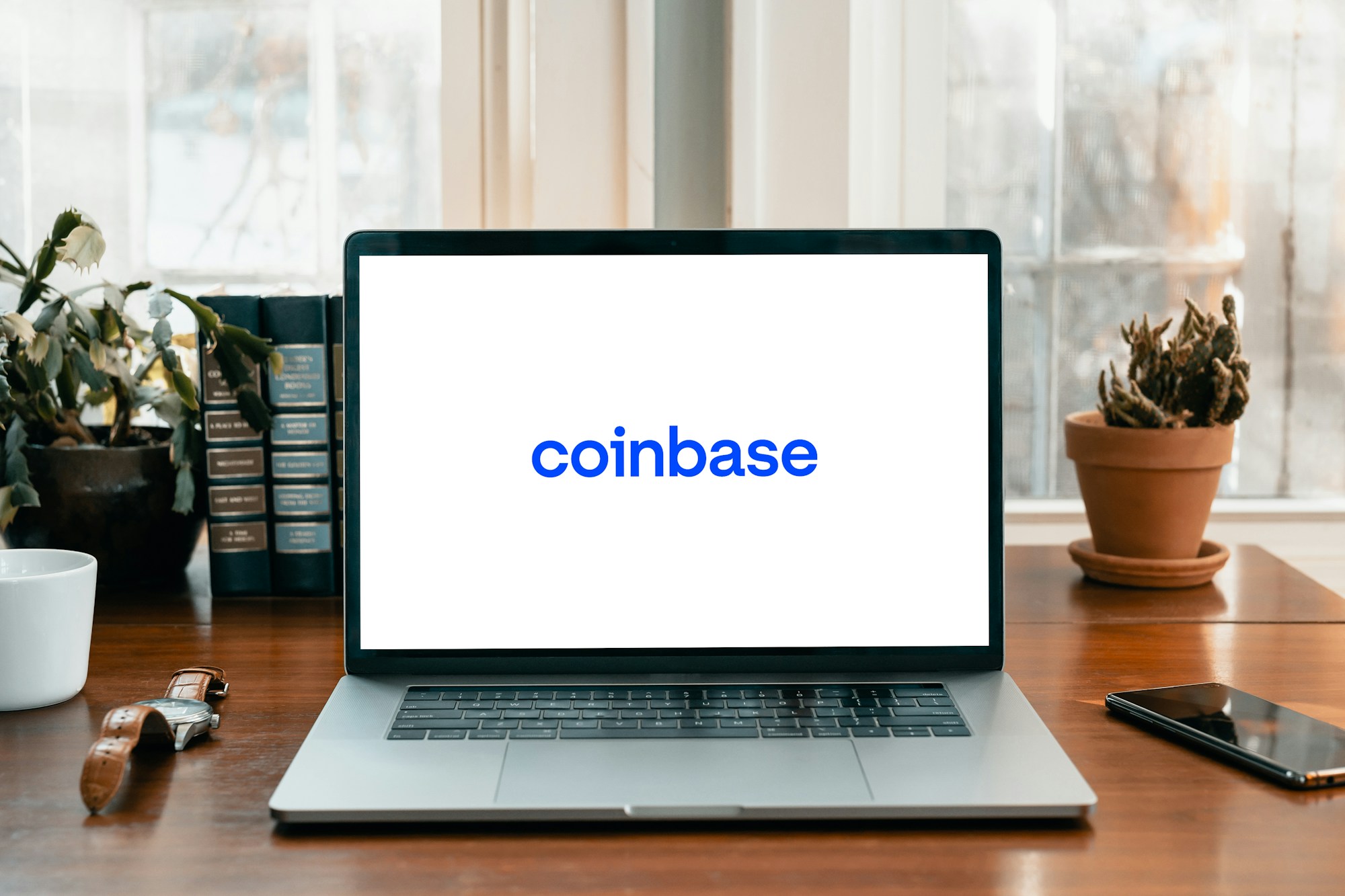 ​Coinbase Cuts 14% of Workforce as AI Push Reshapes Crypto Exchange