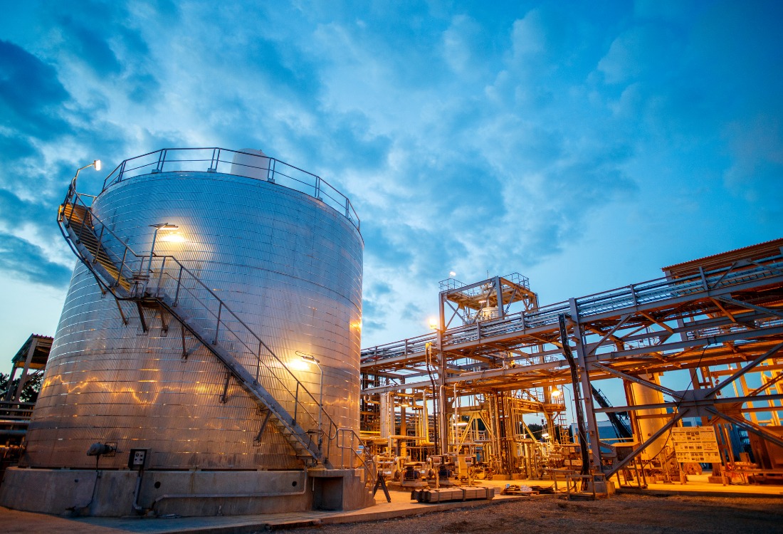 An oil and gas plant in the evening where static mixers are being used for chemical injection and blending.  