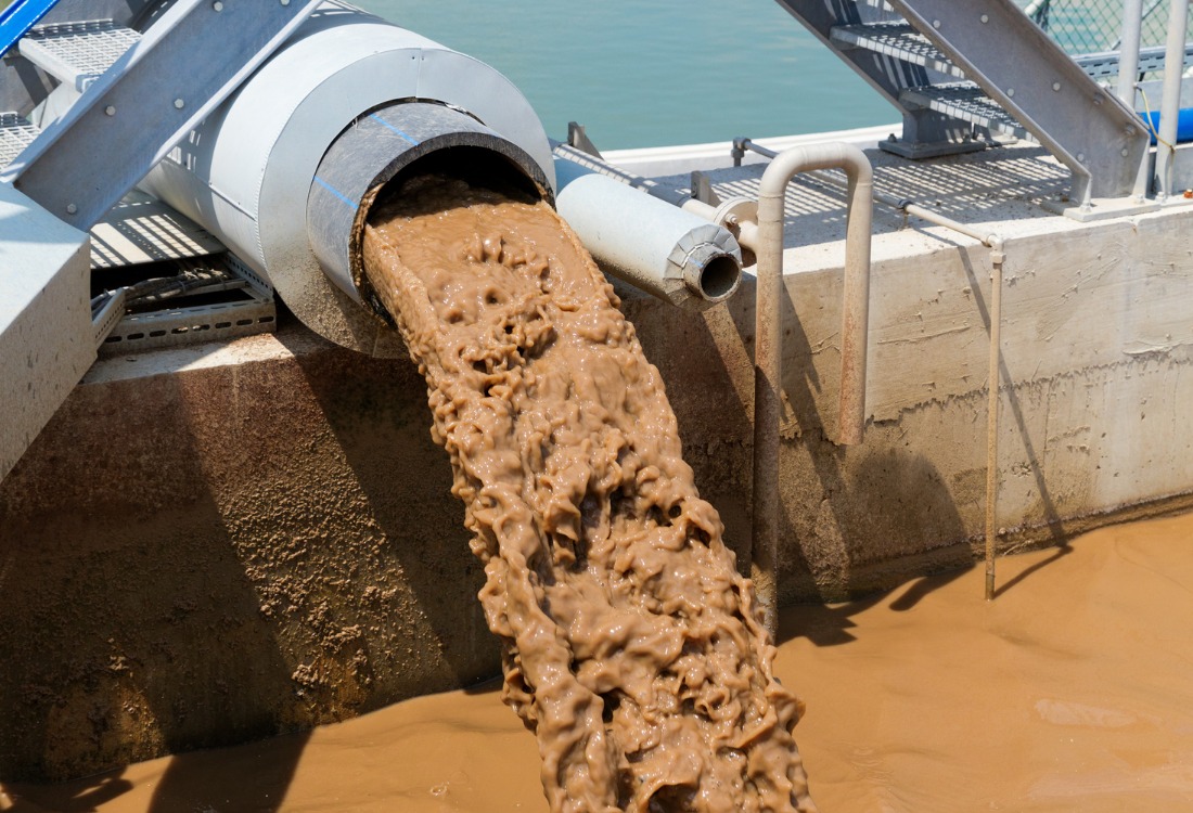Static mixer operating within a sludge dewatering system, enhancing efficiency and solids separation. 