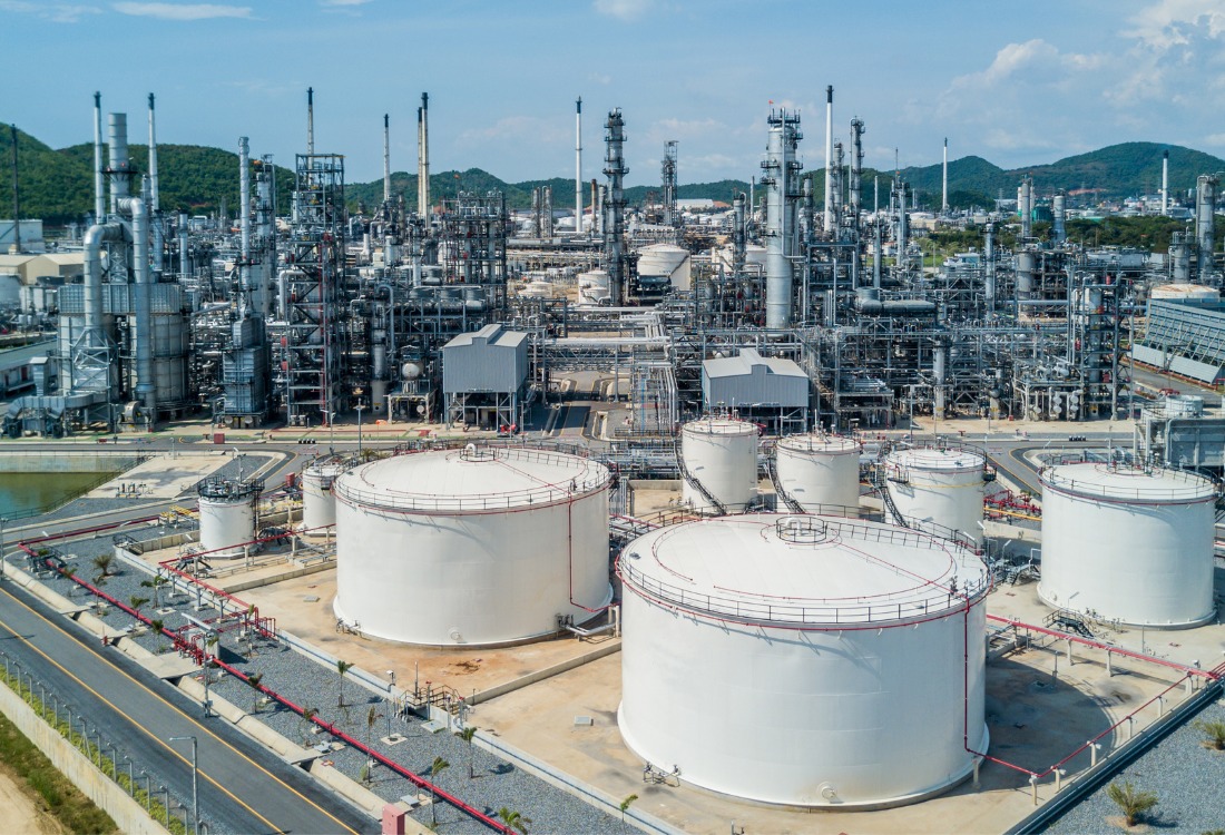 A petrochemical plant on a sunny day, where custody transfer is taking place. 
