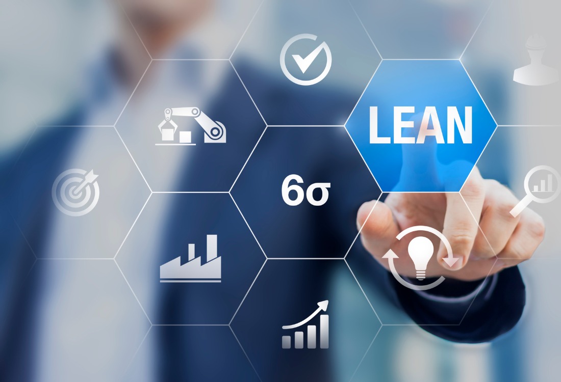 Business professional using a digital interface to support lean manufacturing apprenticeships, showing automation, production metrics, continuous improvement, and Six Sigma icons