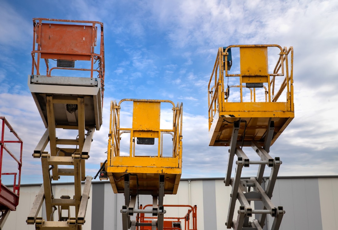 Raised mobile elevating work platforms with scissor lifts, illustrating IPAF Training certification categories teams may need