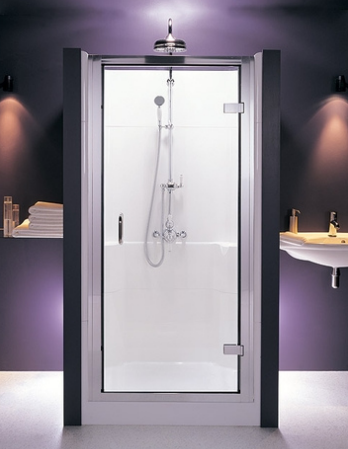 A shower pod in a purple bathroom with lights above.