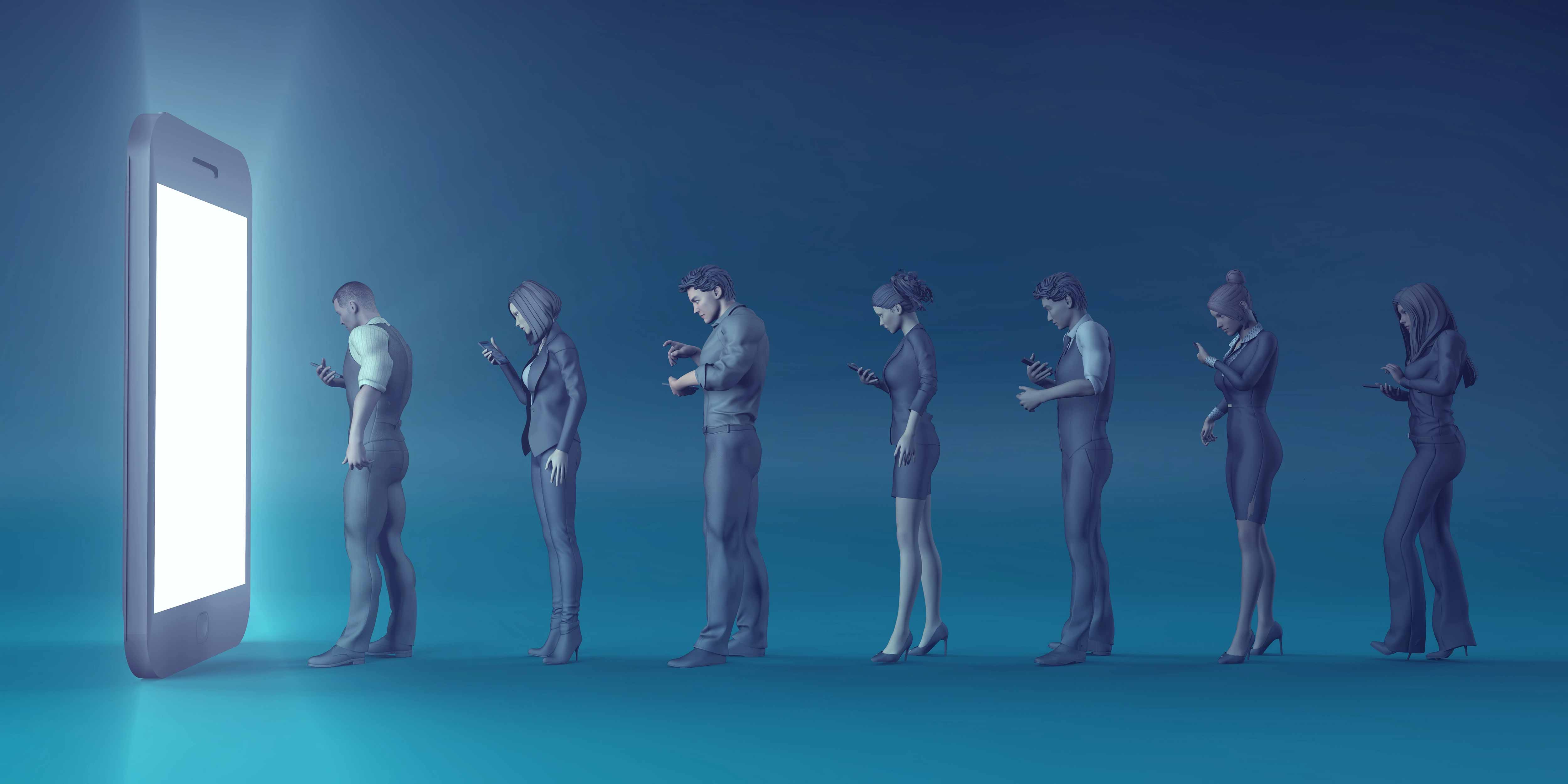 A line of people face down hooked on their devices