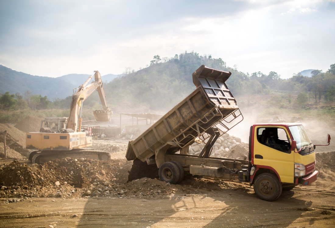 Quarry site with heavy dust emissions in need of fixed foam systems for dust control. 