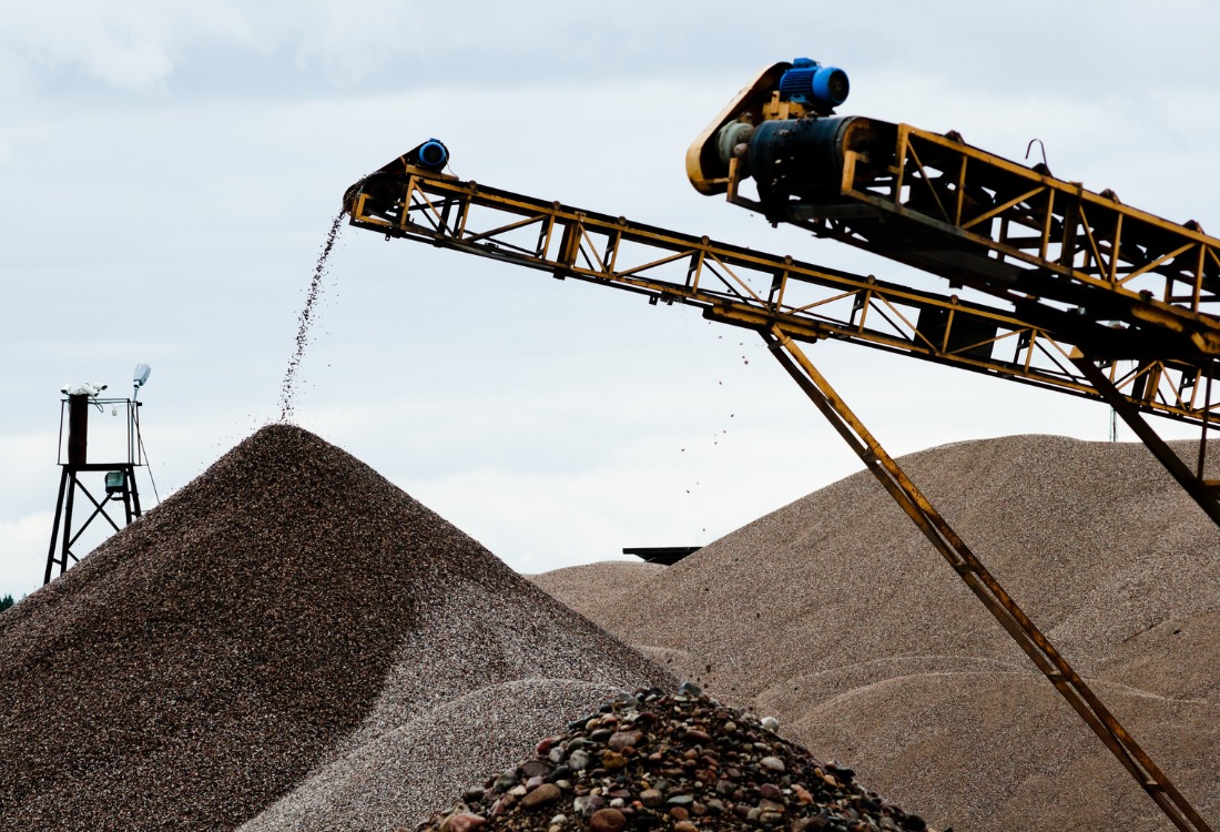 Equipment being used to dump product for mining dust extraction 