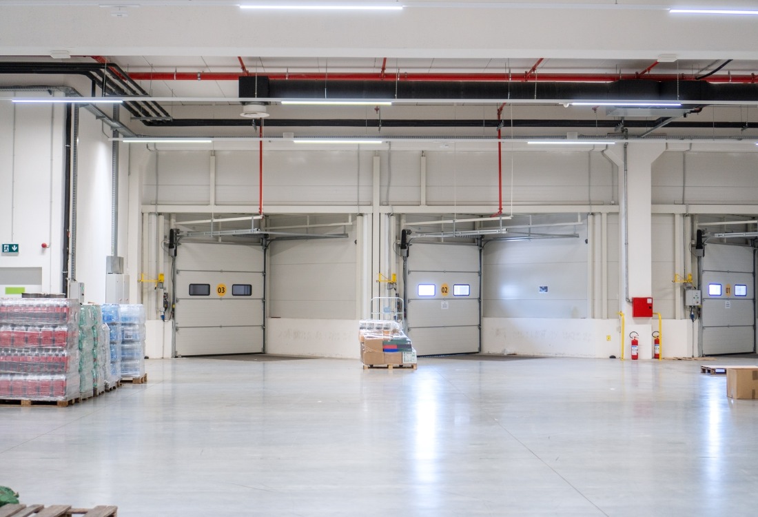 Food processing facility with chemical resistant flooring, ensuring hygiene, durability, and compliance with safety standards.