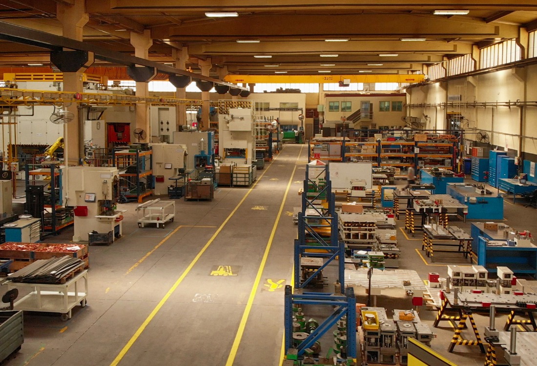 Industrial facility floor with clear permanent safety markings guiding workers and machinery, reinforcing the importance of workplace safety.