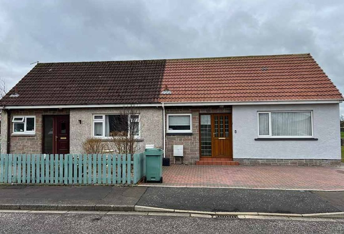 Home with partially roof coating applied to prevent leaks and water damage
