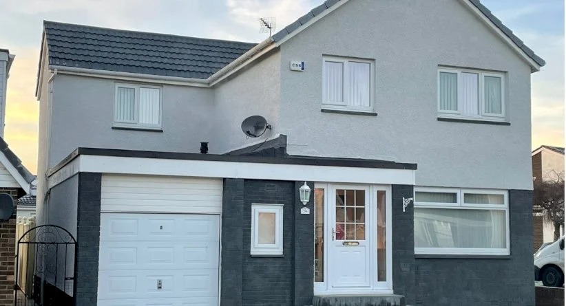 Front view of a modern Scottish home with a clean, freshly coated roof.