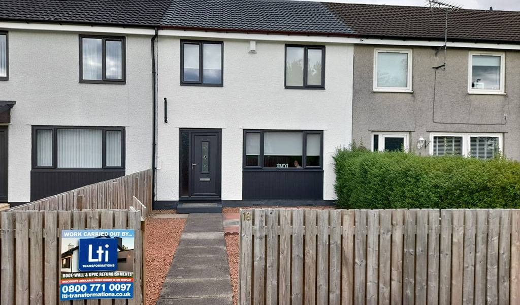 Scottish residential homes with professional roof coating for weather protection.