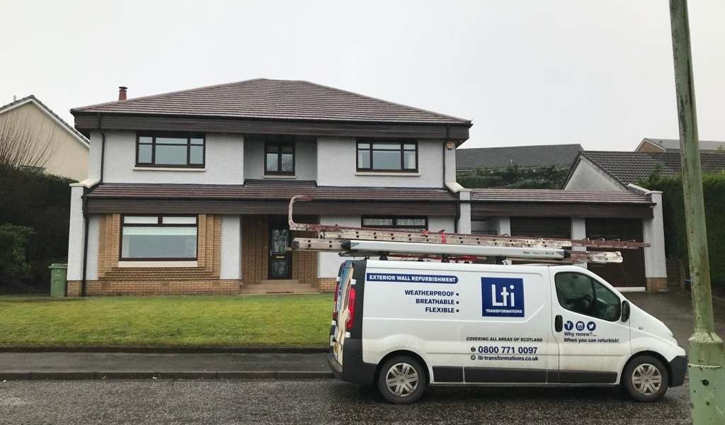House in Scotland being treated with protective roof coating to prevent weather damage.