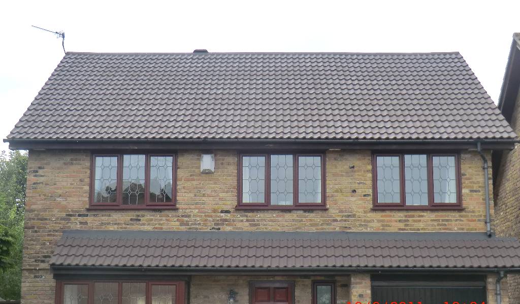Scottish home with professionally refurbished roof tiles and protective coating.