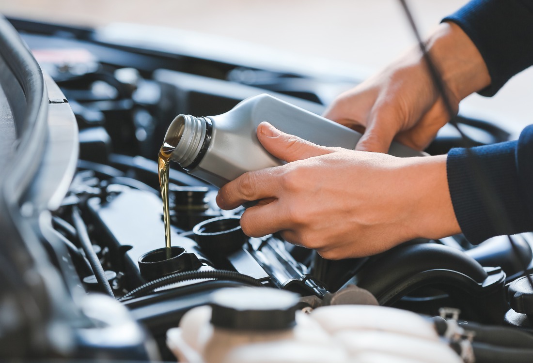 A car undergoing an oil change as part of their routine summer maintenance.
