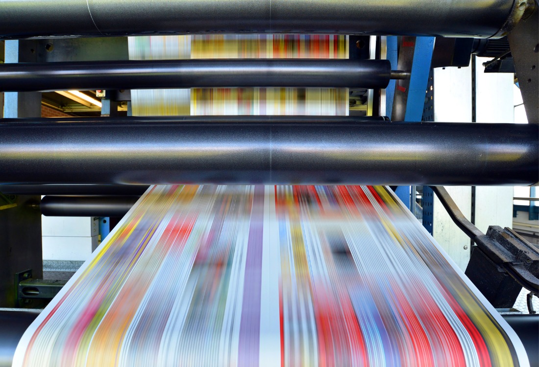 High-speed large format printing machine producing vibrant graphics for commercial print projects.
