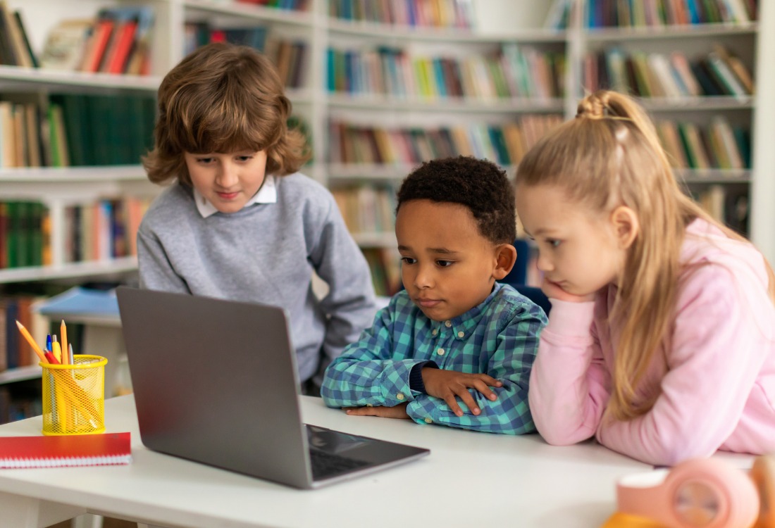 Pupils in a school classroom using 1:2:1 technology.