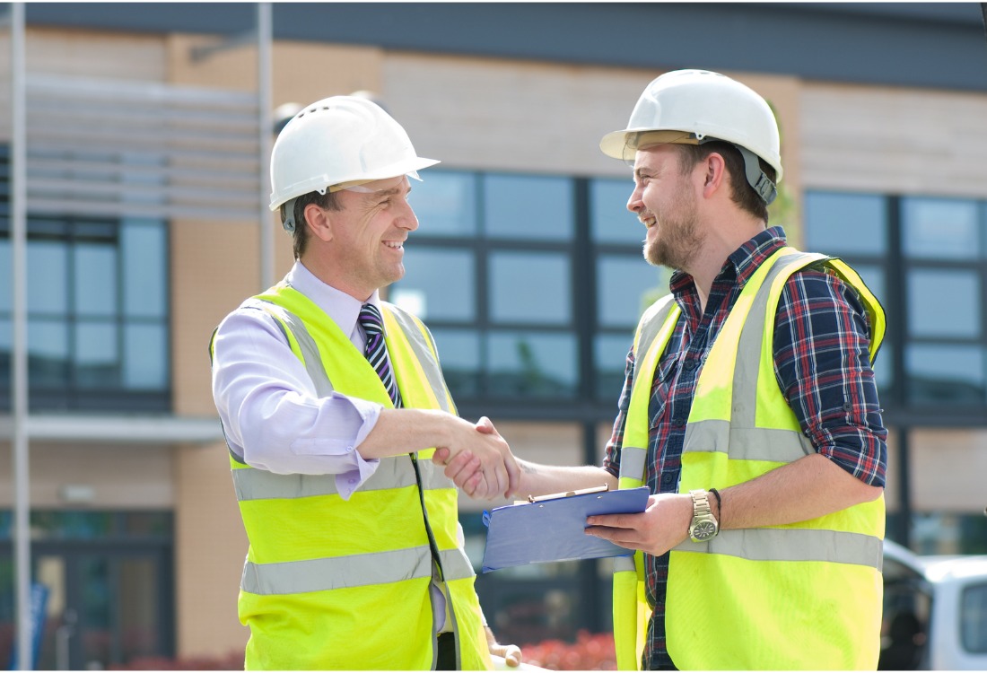 A contractor greeting his curtain walling sub-contractor, whom he has chosen for its knowledge and expertise. 