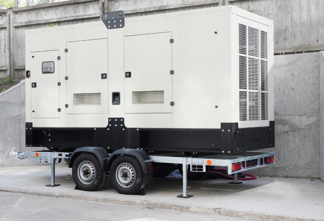 An emergency back up generator on a transporter on the way to getting installed.
