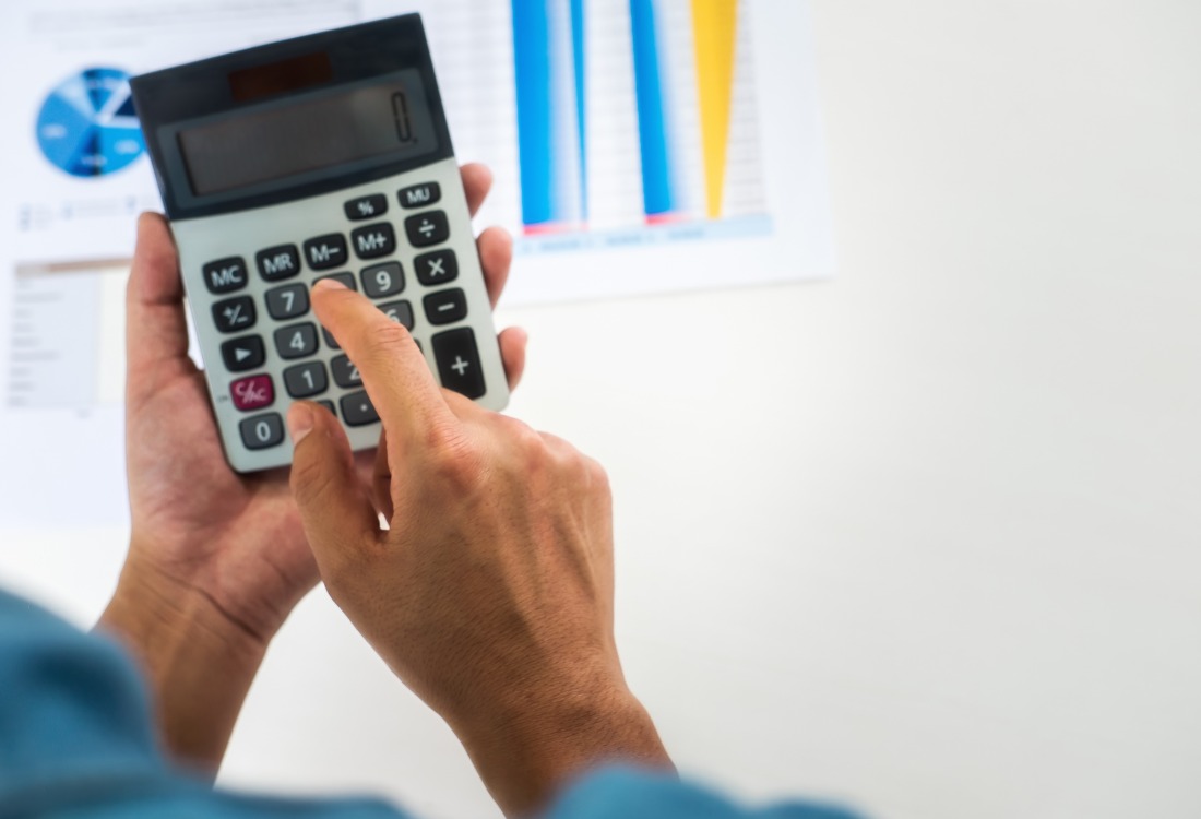 A person is calculating how much the government pays towards apprenticeships.