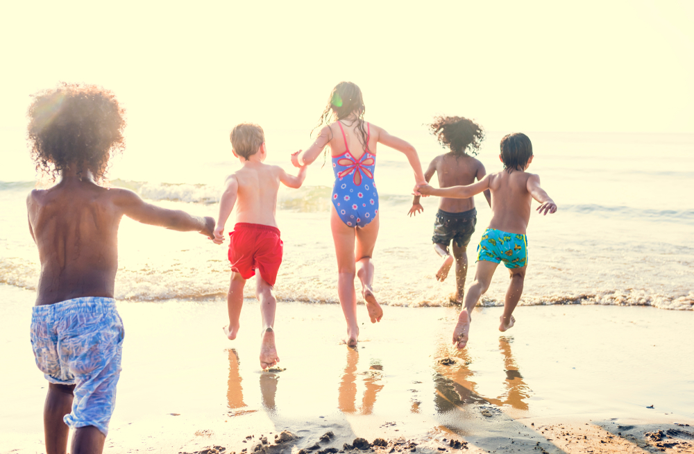 Bystander supporting families during beach rejection moment - child trying to make friends