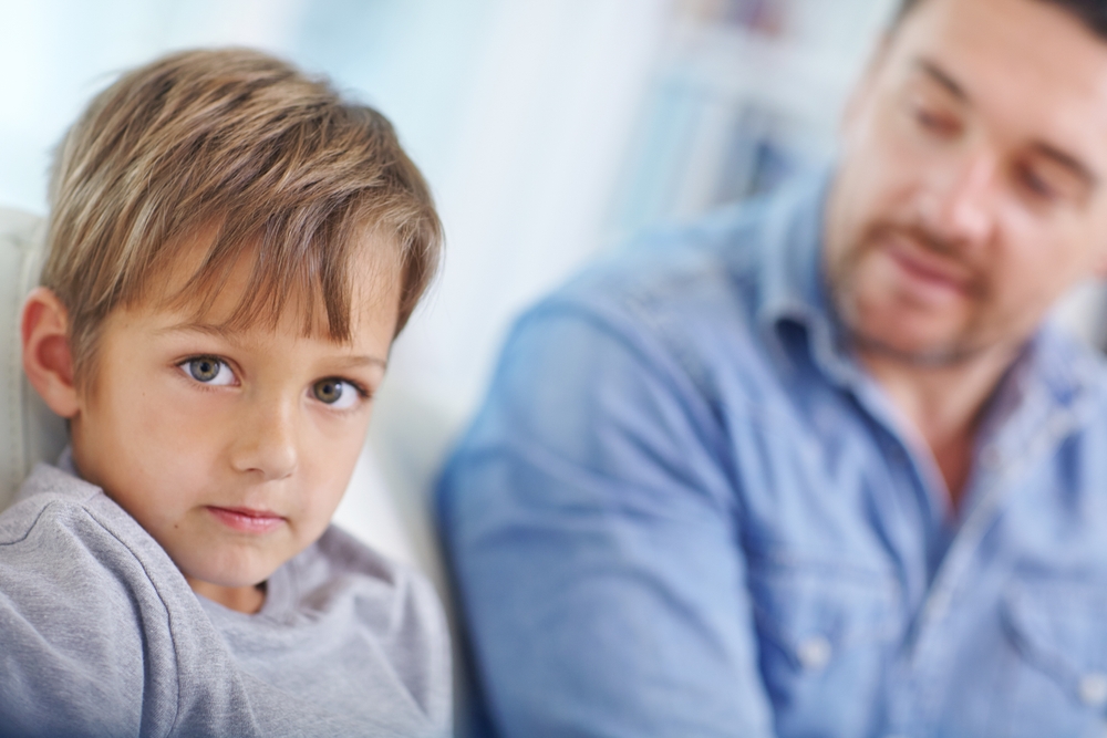 Bystander supporting parent repairing relationship with child in public - parent apologizing after yelling