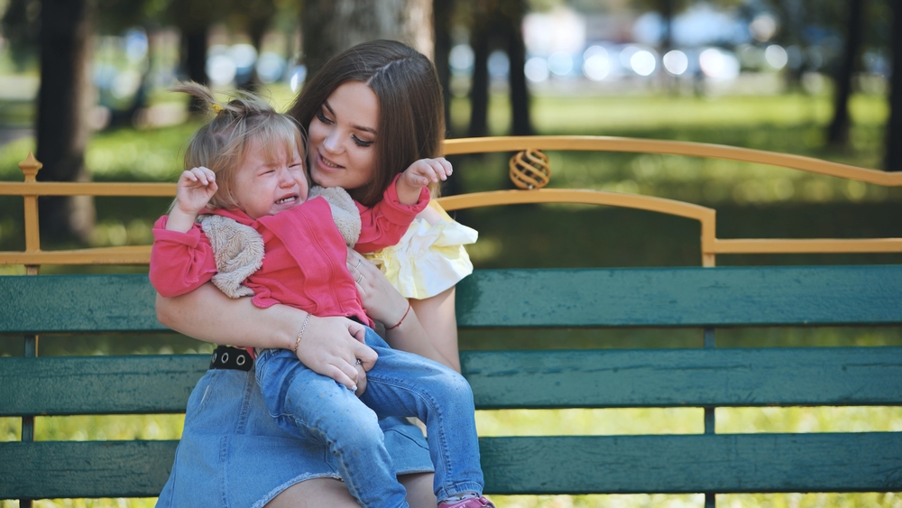 Bystander supporting parent and child during public meltdown - protecting child dignity