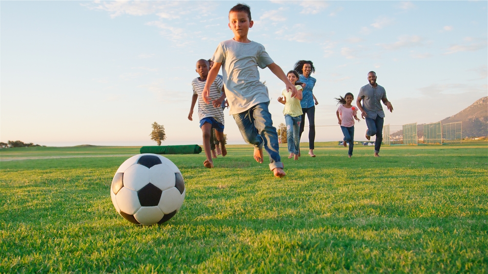 Bystander supporting overscheduled family during transition - parent rushing kids to activities