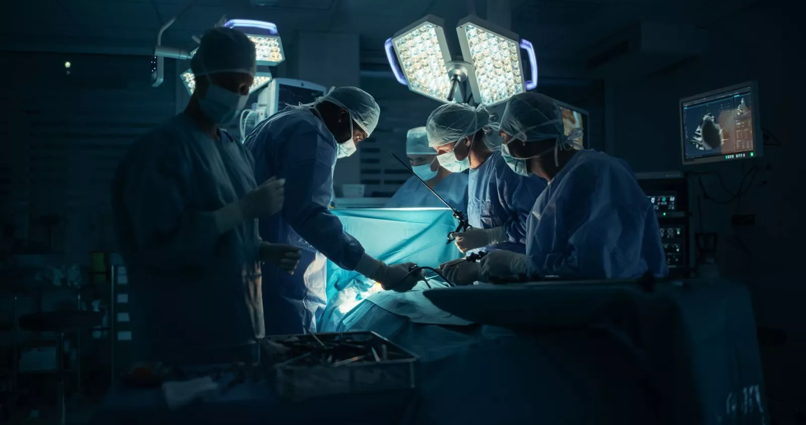 Surgeons performing a laparoscopic procedure.
