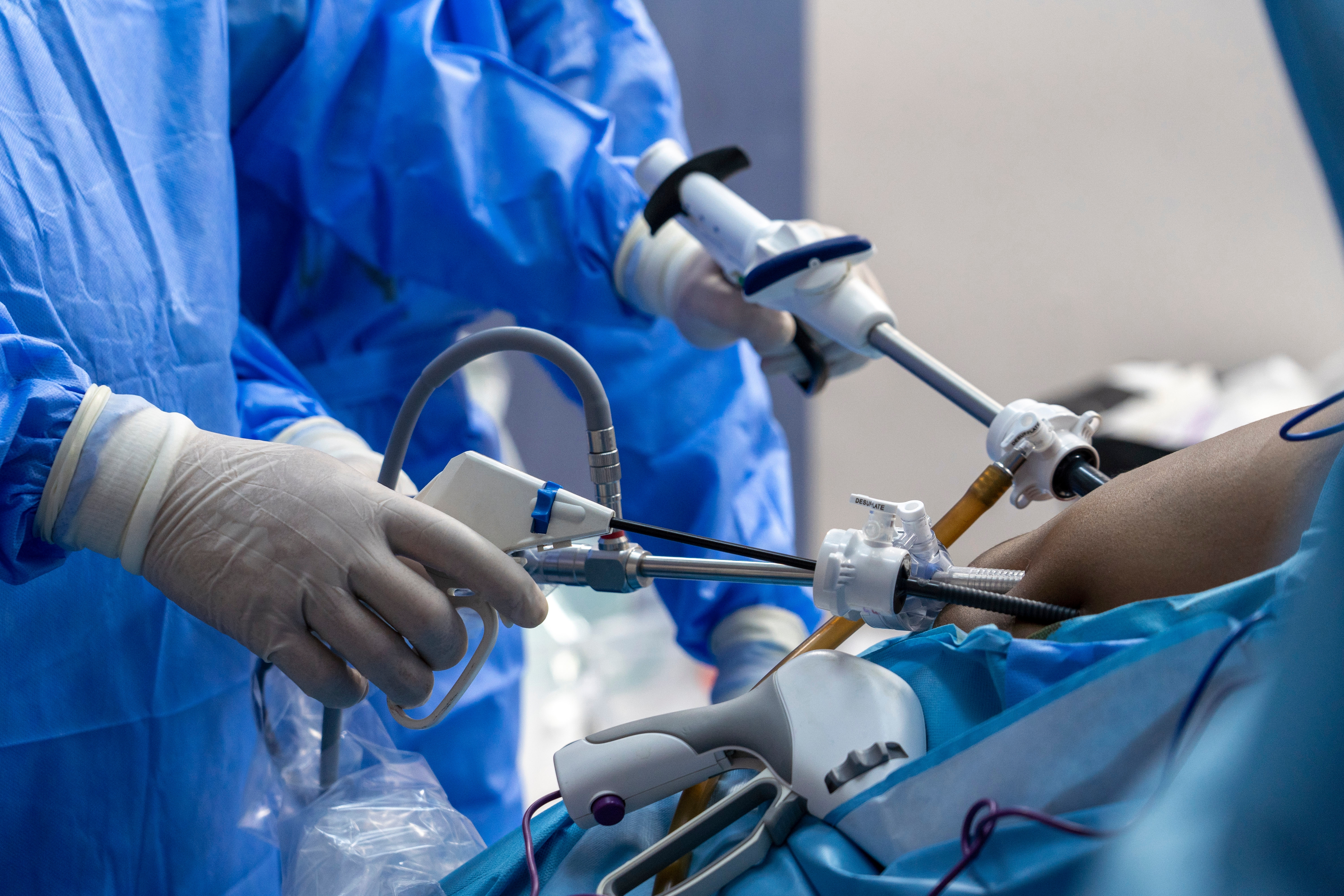 Surgeons using laparascopic instruments.