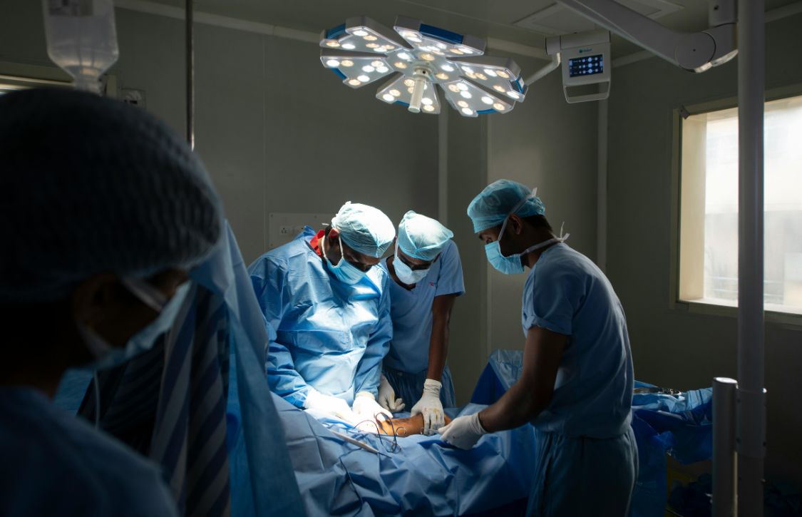 surgeons during a robot-assisted surgery closure