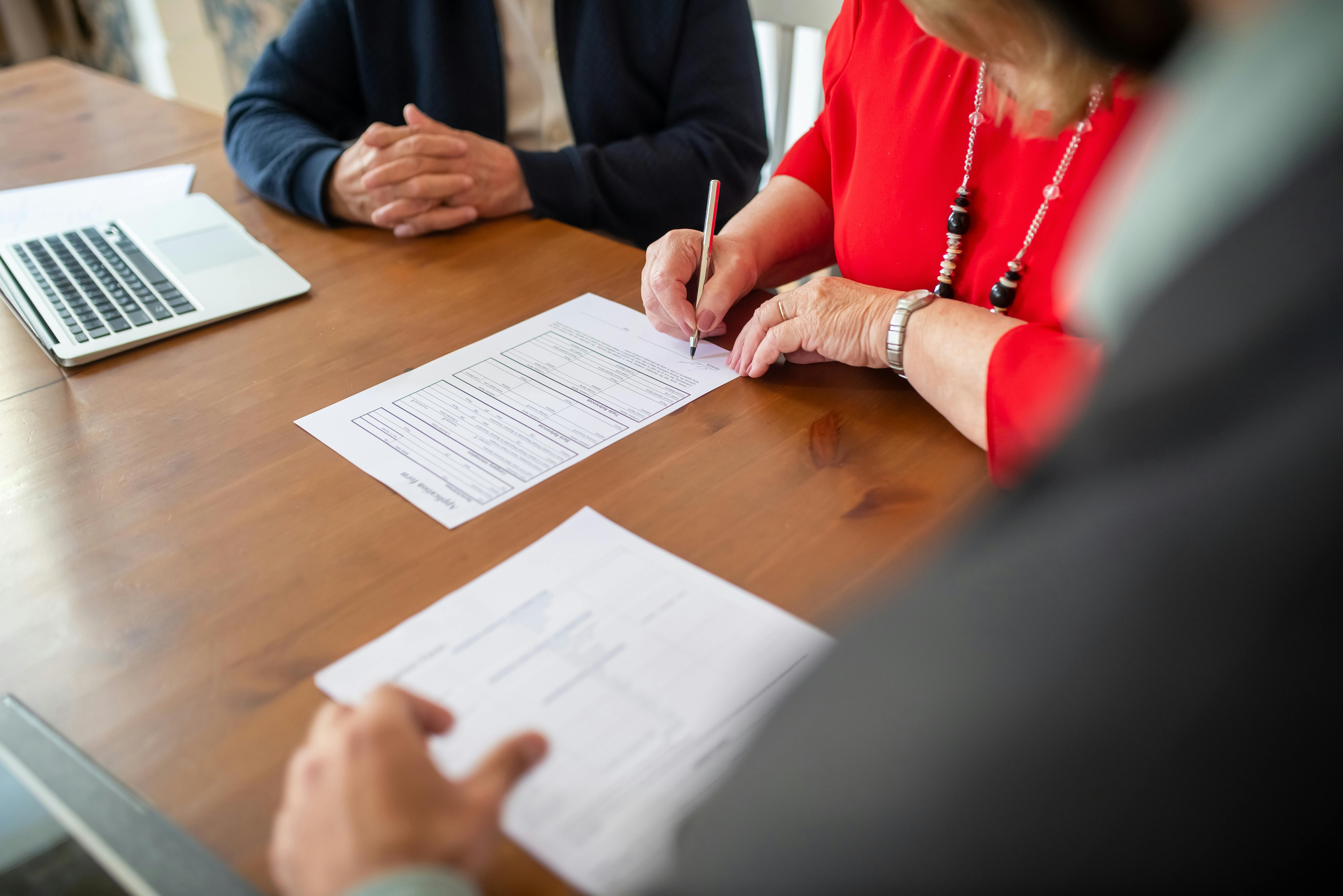 This photo features subrogation recover services singing documents