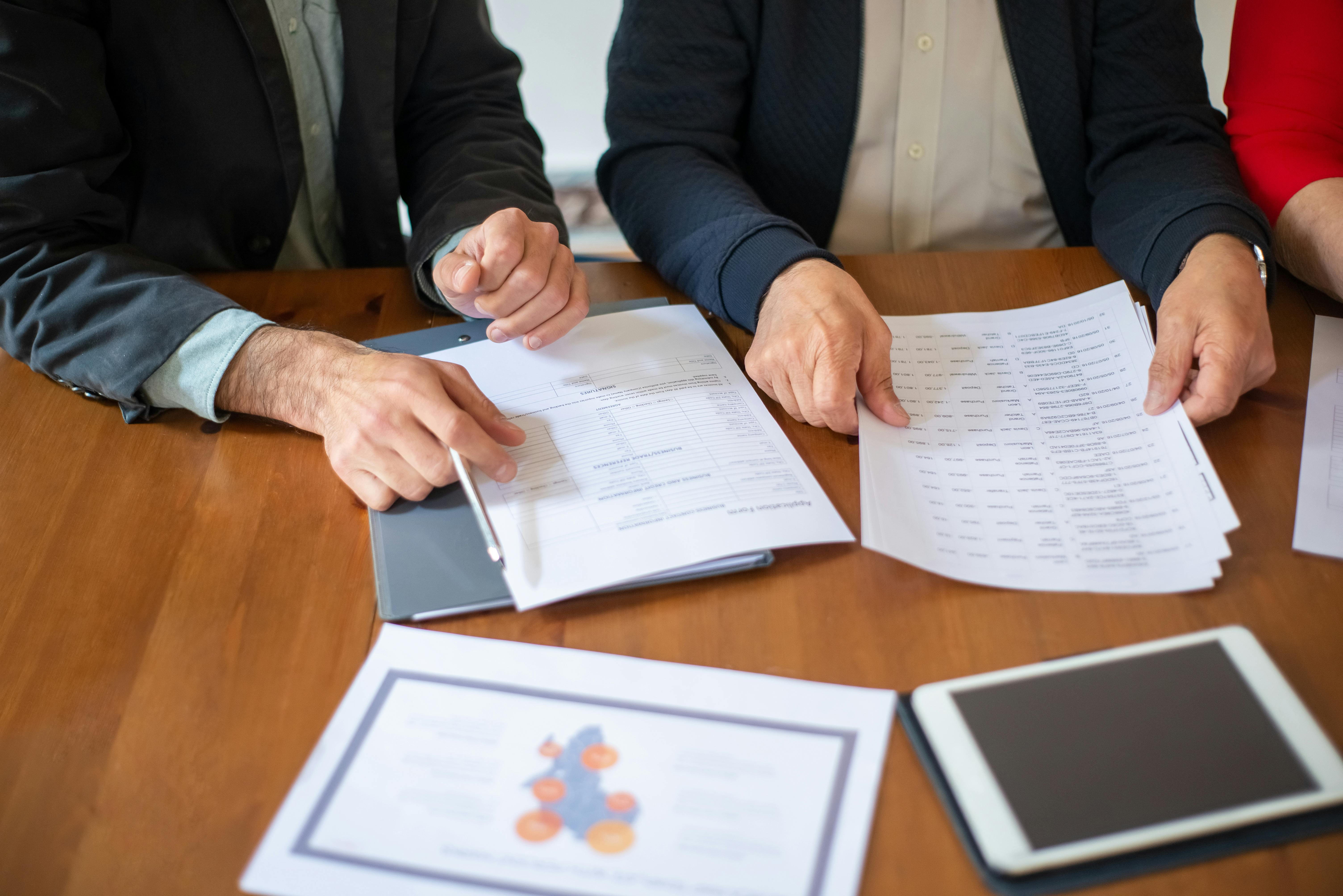 This photo features subrogation recovery specialists organizing papers
