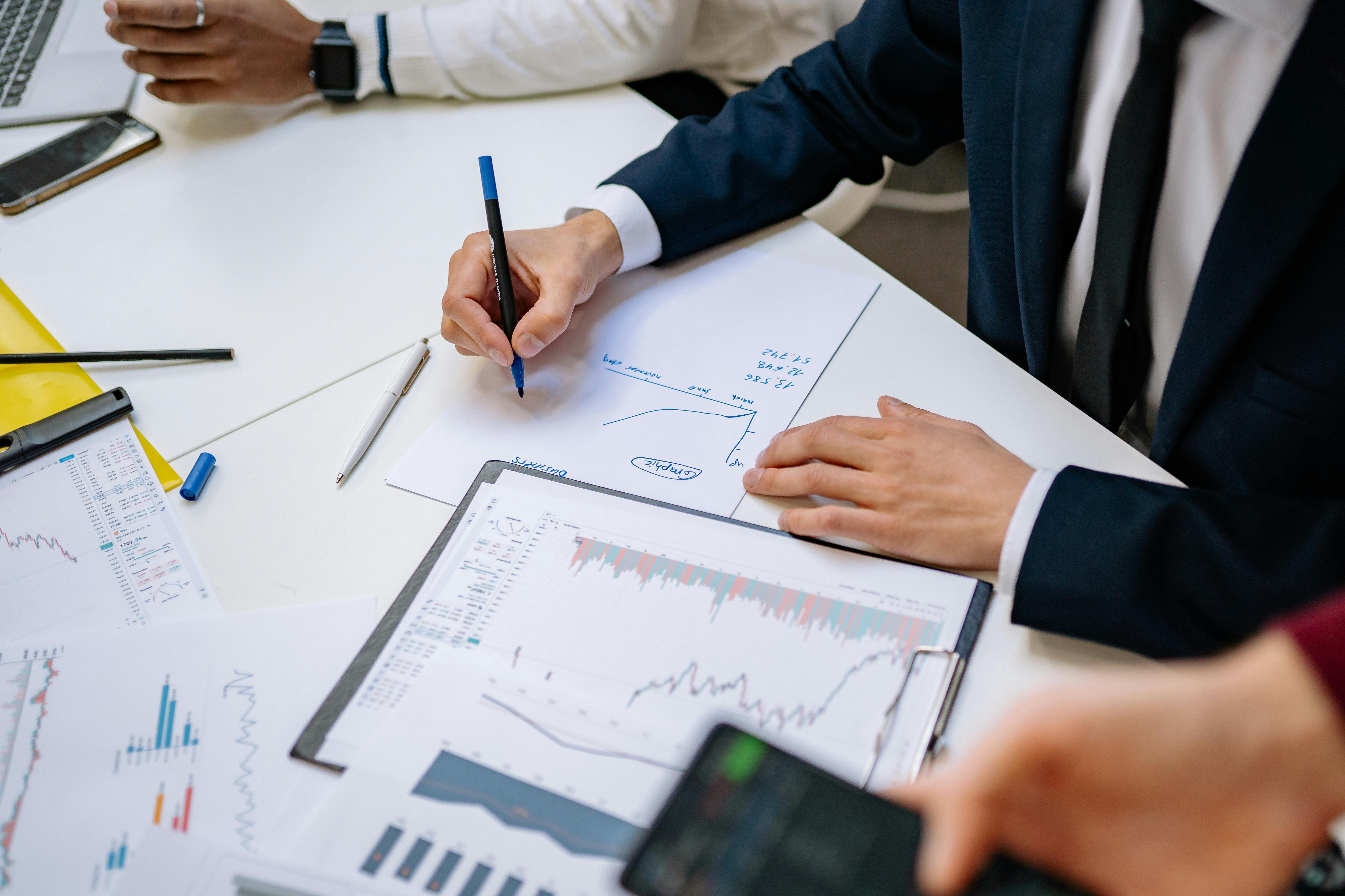 This photo features a subrogation specialist writing on a paper