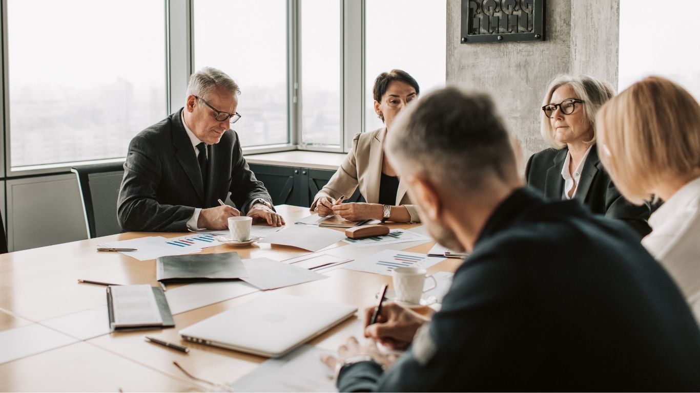 A group of auditors meeting to discuss regulatory alignment for QC Programs.