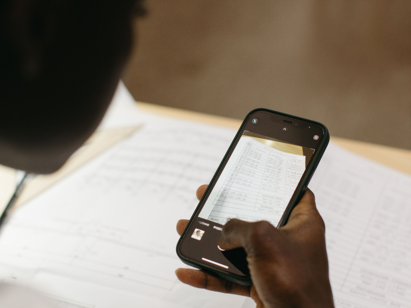 A user scanning a document with an OCR ready phone.