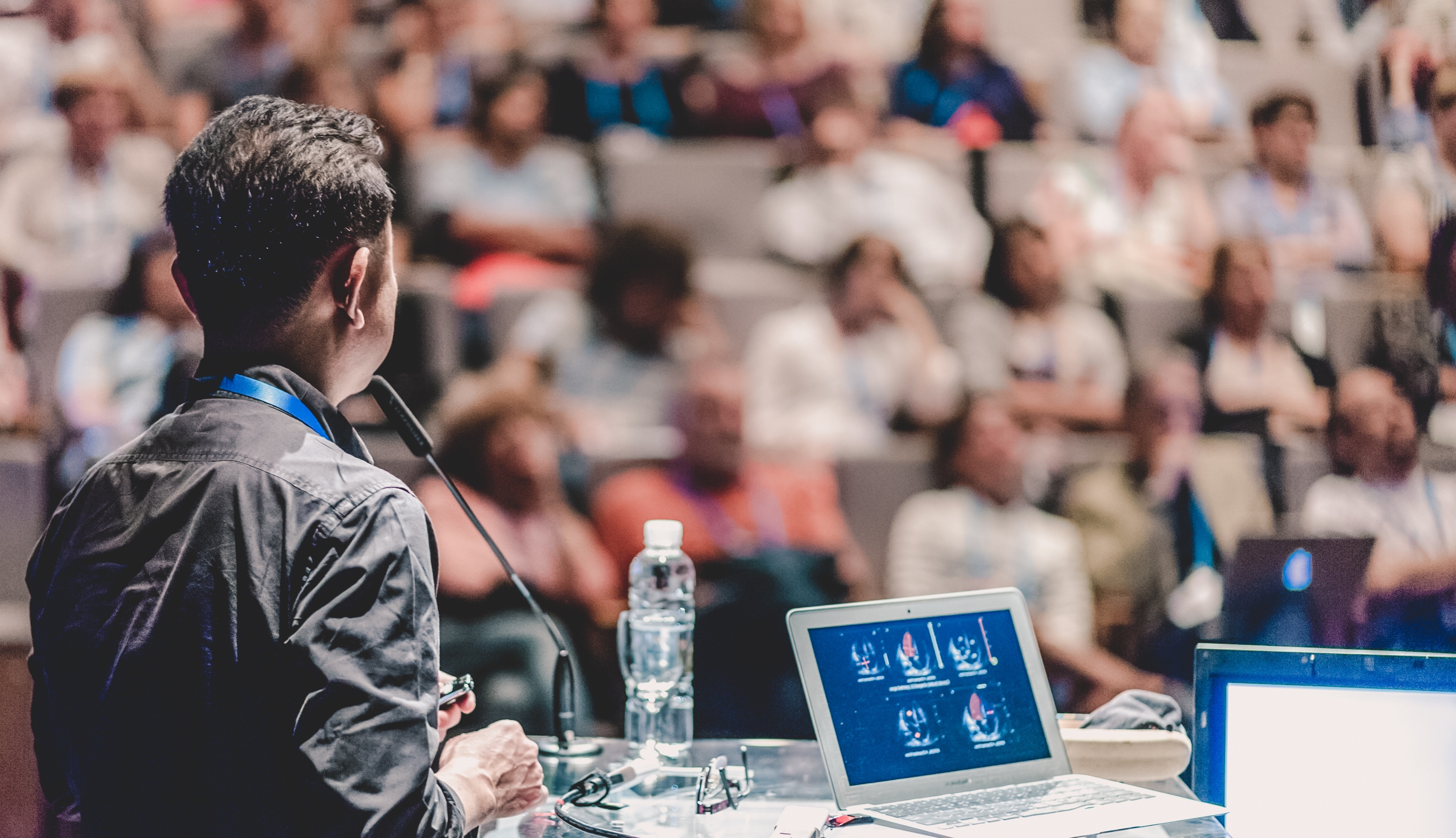 Scientist presenting peer-reviewed research findings at a scientific conference
