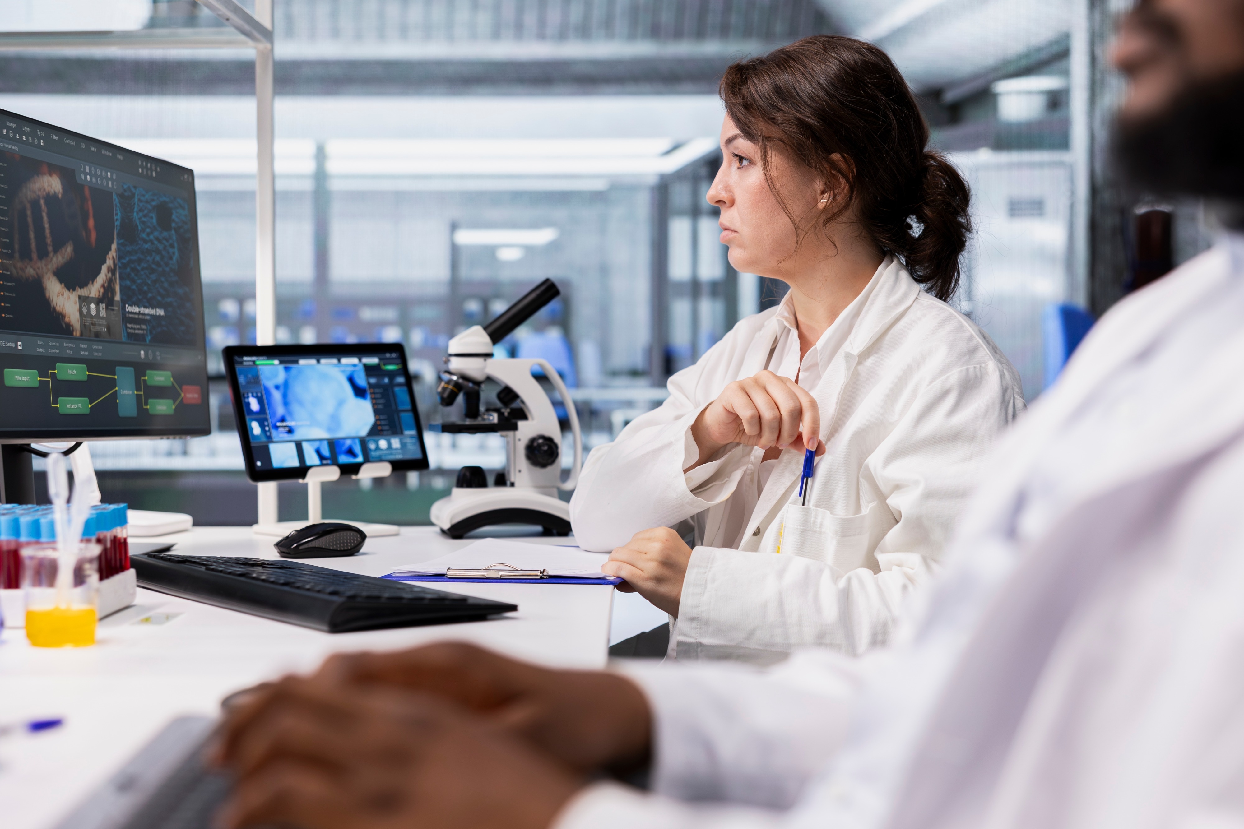 Scientist analyzing genomic and molecular data from a preclinical research study